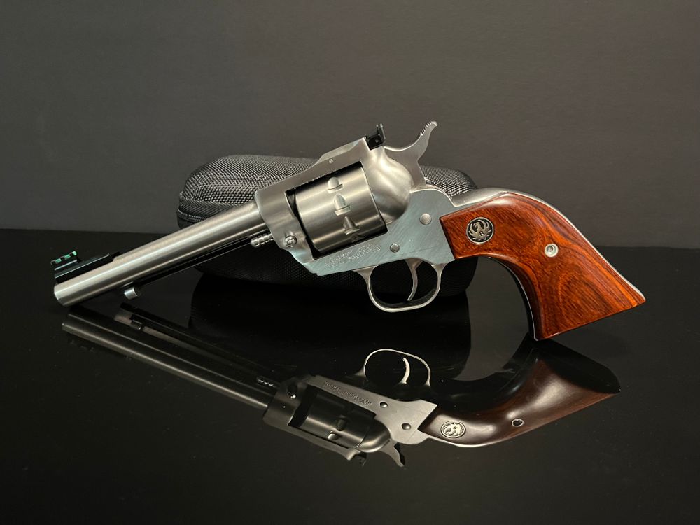 Revolver Gun Background Revolver on Gray Background · Free Stock Photo