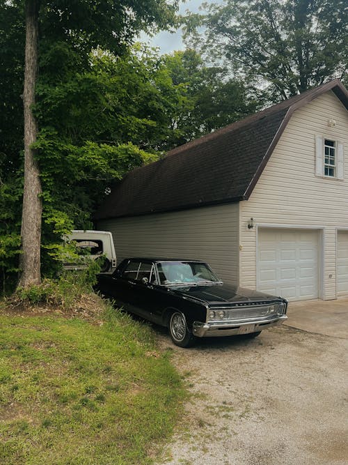 Black Chrysler Newport near House