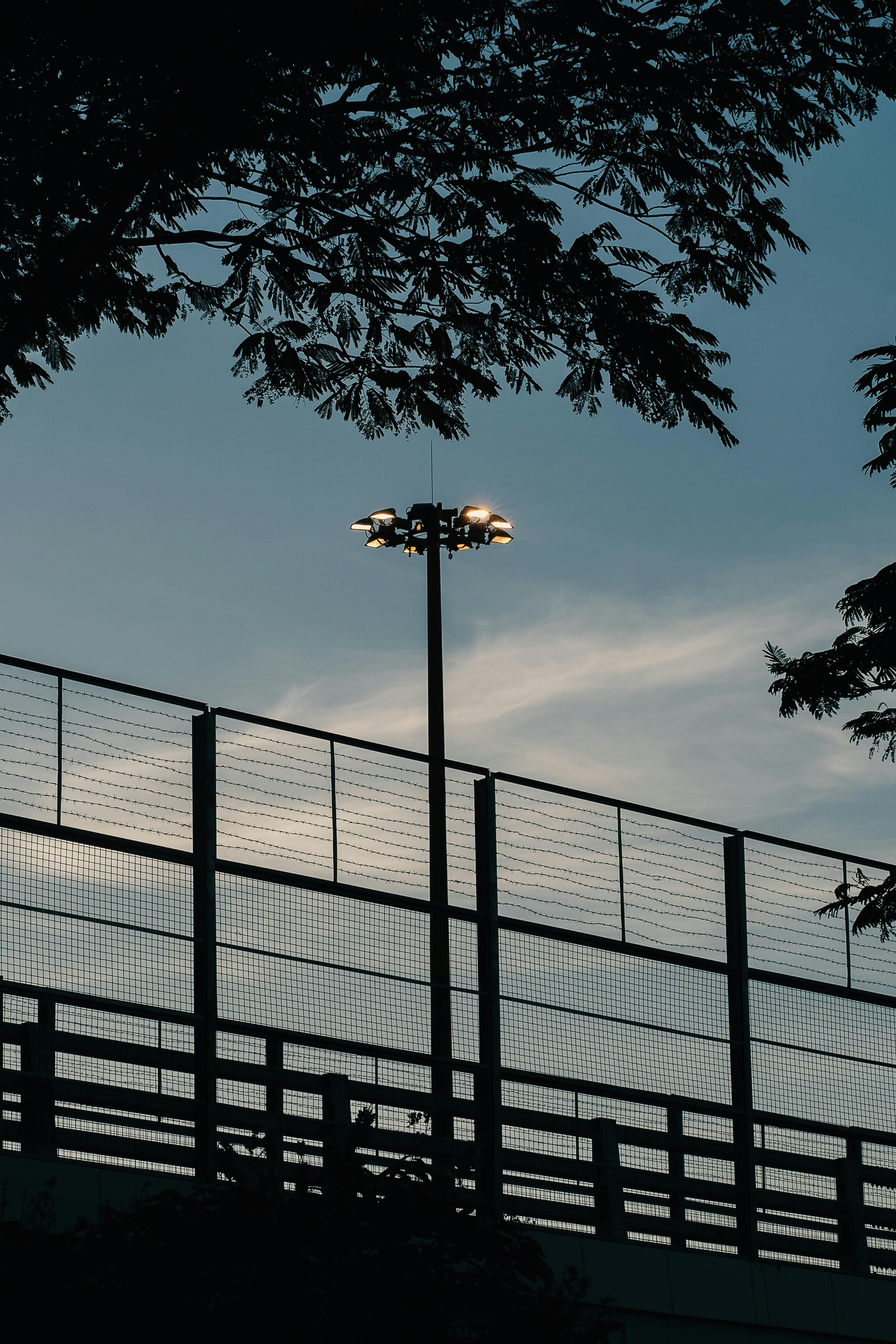 Reflector behind Fence · Free Stock Photo