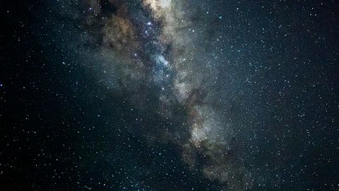 A breathtaking vertical shot of the Milky Way galaxy from Cacoal, Brazil, showcasing countless stars in a dark sky.