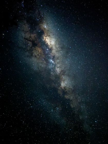 Milky Way over a dark ridge, photo by Ademir Mattos on Pexels
