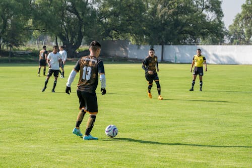 Young Men Playing Soccer 