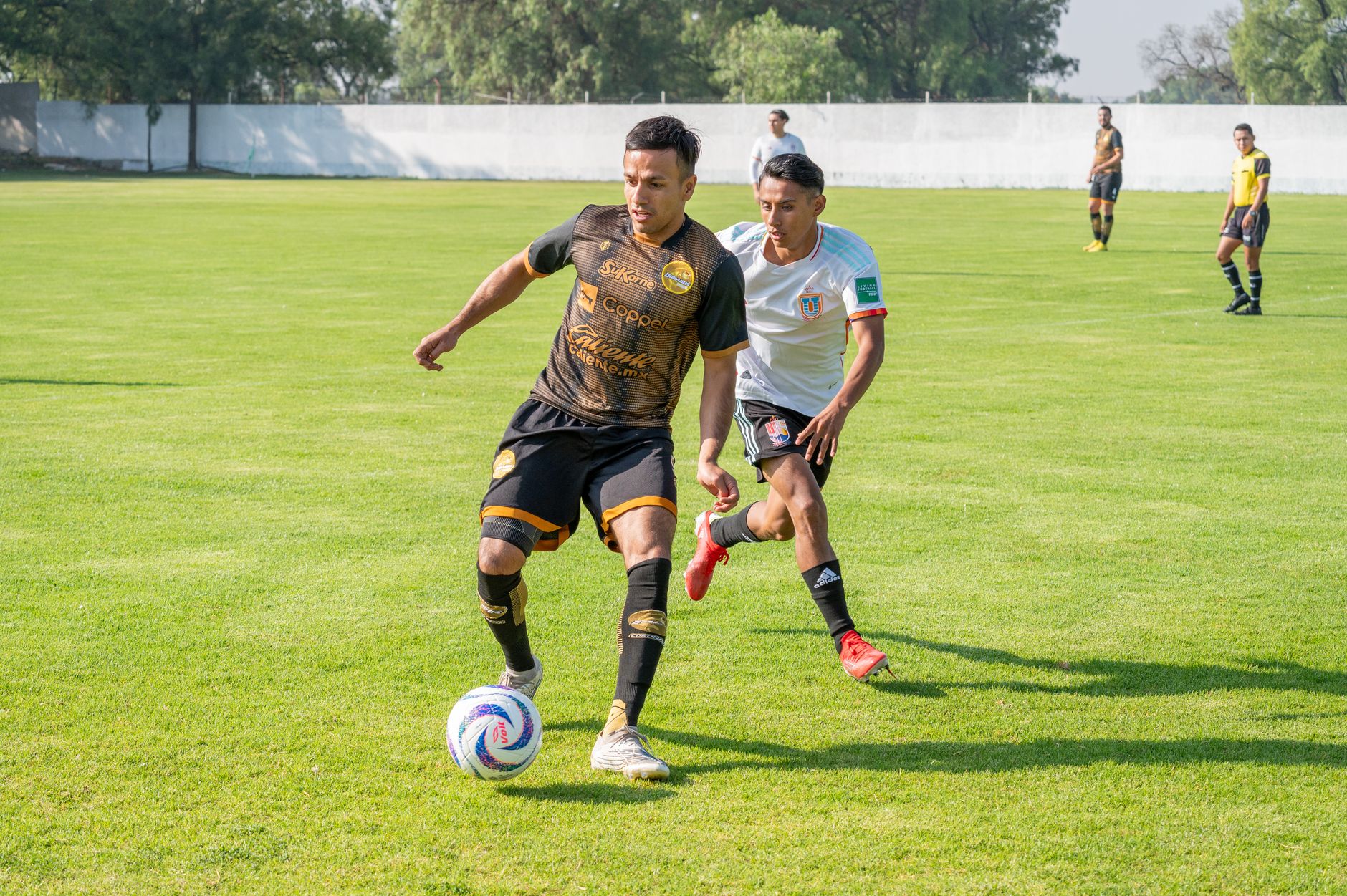 Cape Verde midfielder carrying the ball through midfield during a tense World Cup qualifying match