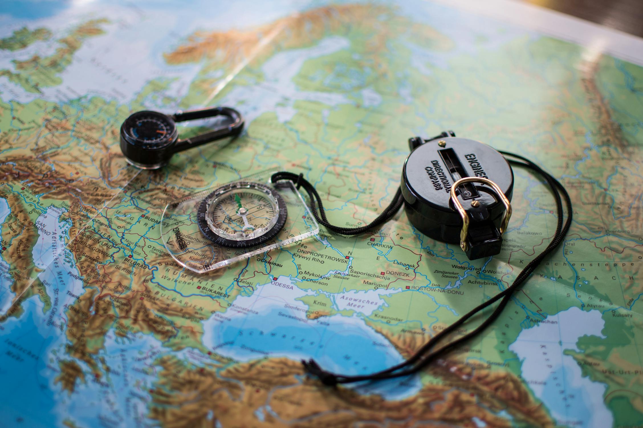 A Compass on a World Map · Free Stock Photo