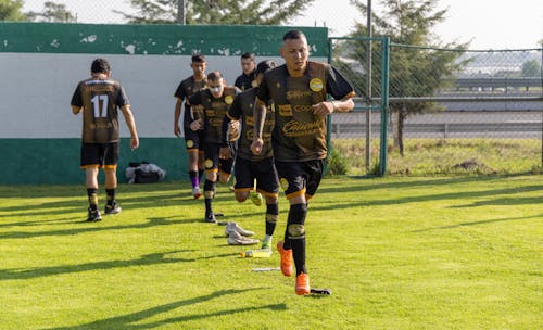 Men Training on the Soccer Field