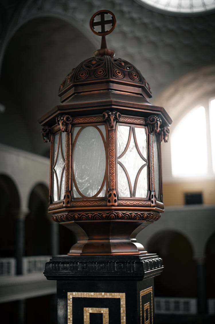 Brass Lantern On A Ornate Pedestal