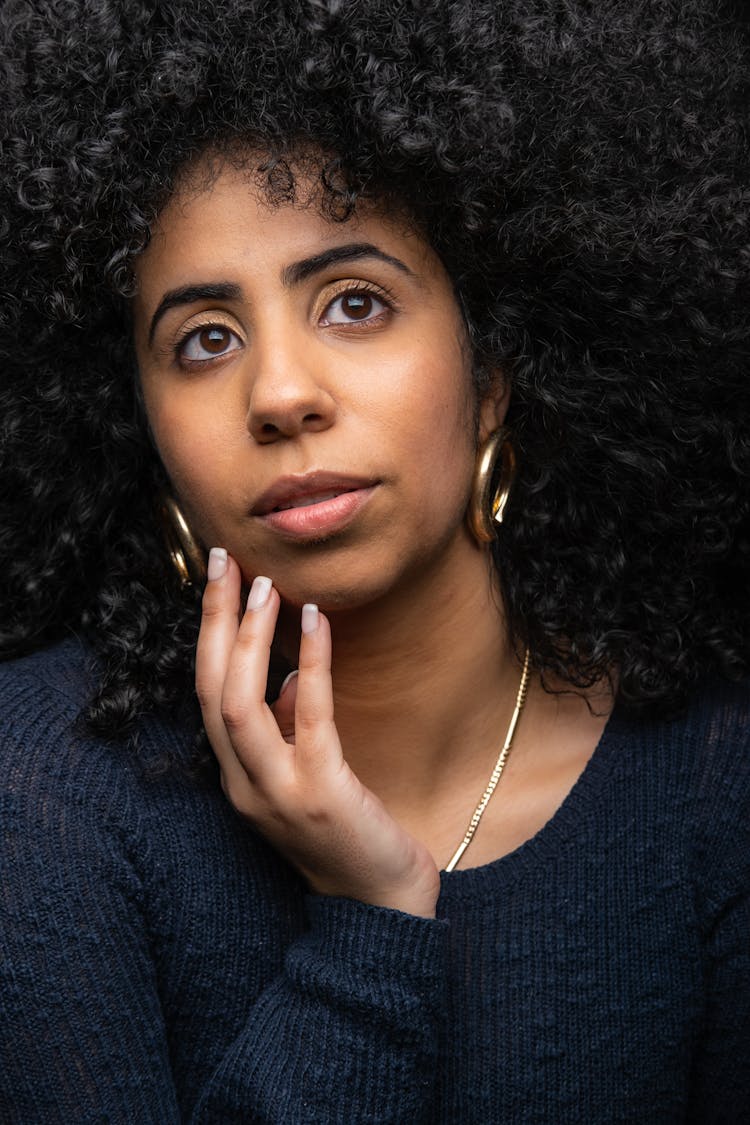 Portrait Of A Young Brunette In Black Sweater