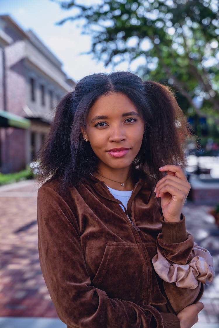 Young Woman Standing Outside In A Hoodie 