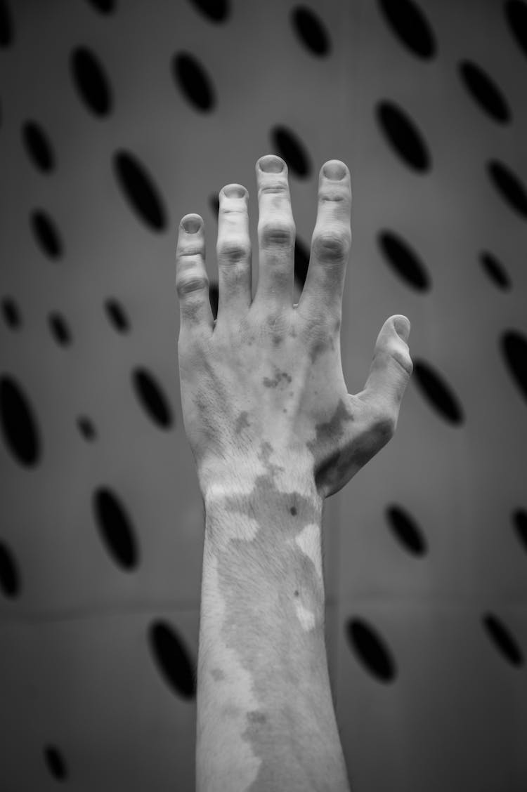 Close-up Of Man Hand Raising In Air