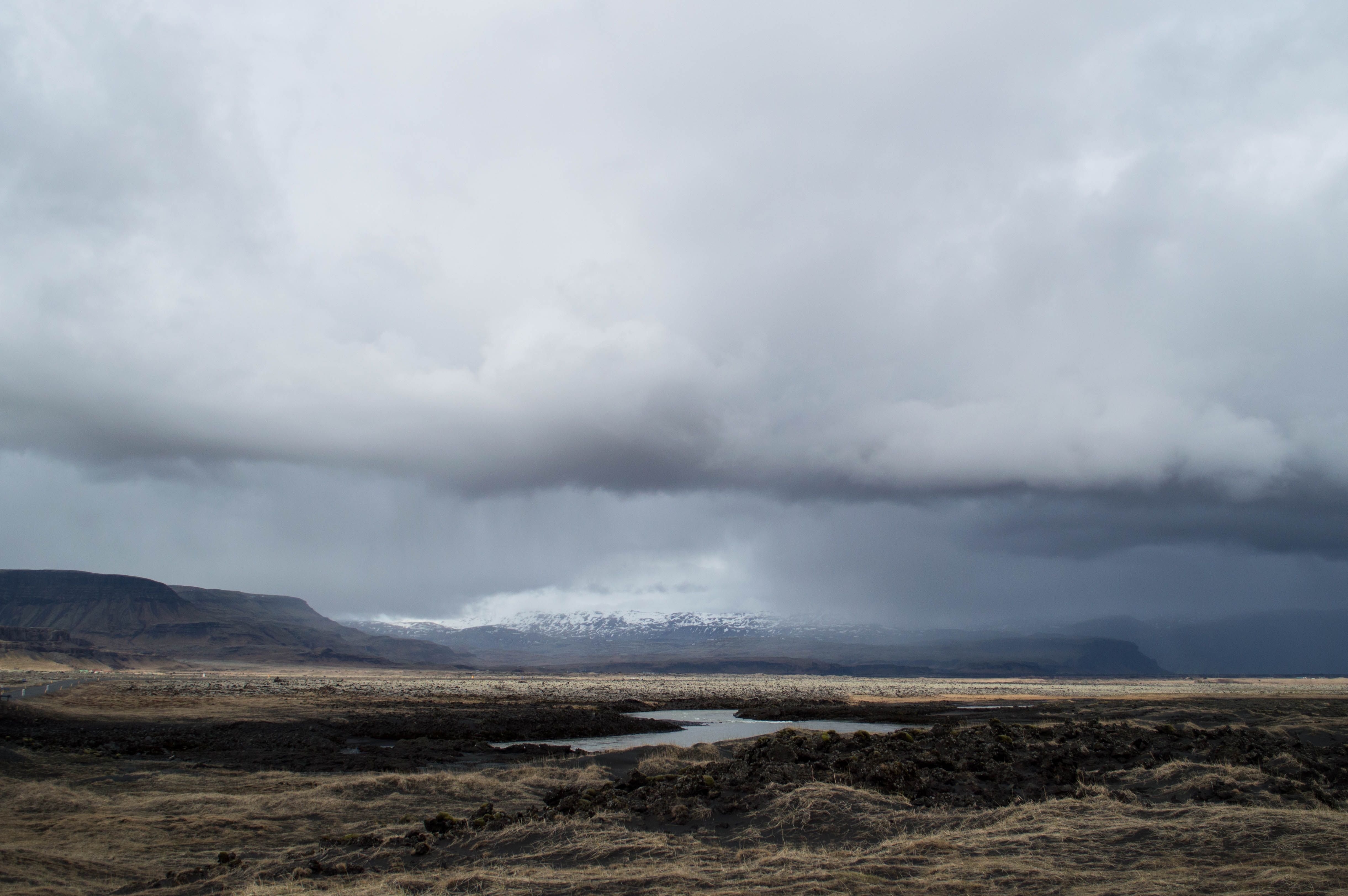 A view of a valley with mountains and clouds · Free Stock Photo