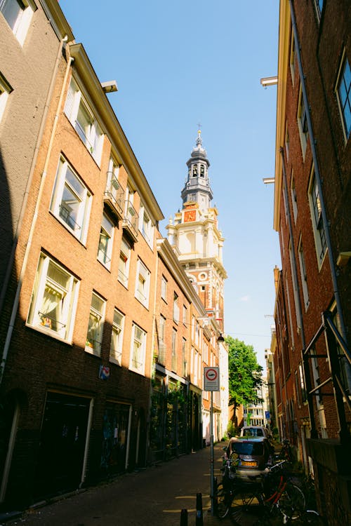 Buildings along the Alley and the Tower of the Zuiderkerk in Nieuwmarkt Area of Amsterdam