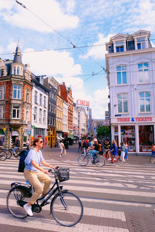 Cyclists and Pedestrians on Street in Amsterdam, Netherlands