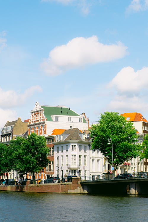 Foto d'estoc gratuïta de amsterdam, canal, cases adossades