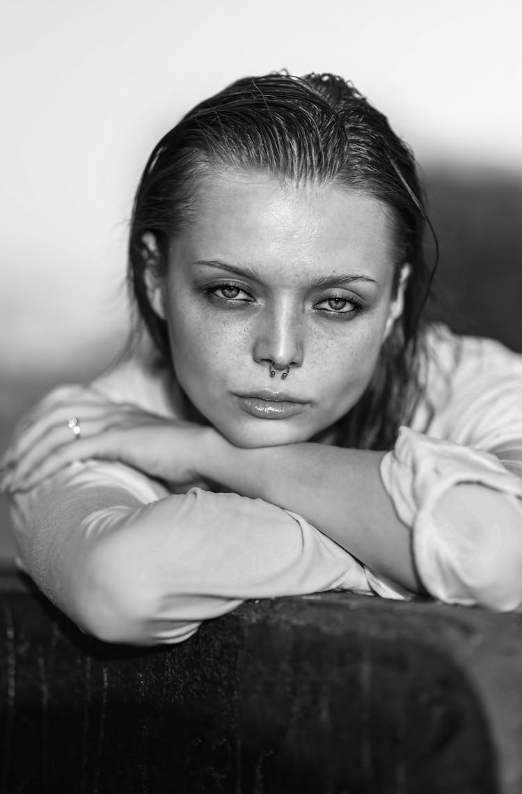 Black And White Portrait Of A Young Woman With Wet Hair And A Nose Piercing 