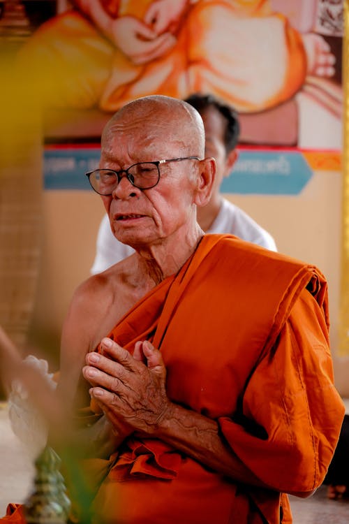 Man in Eyeglasses and a Gown