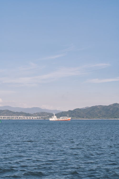 Sea Coast with Sailing Vessel behind