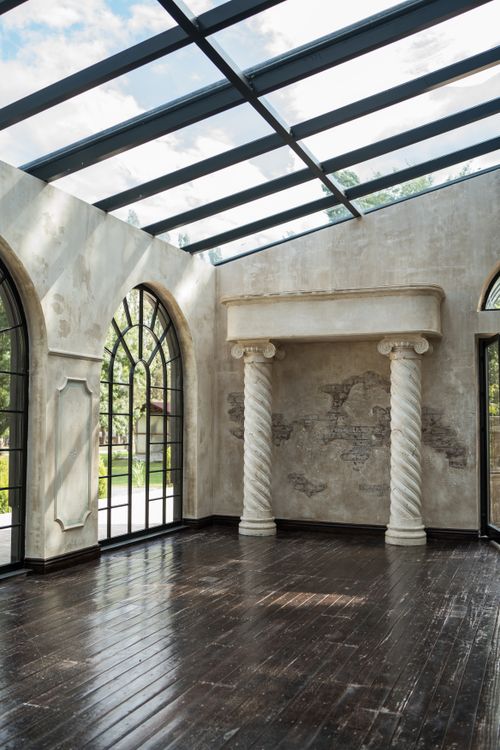 Free Beautiful indoor pavilion featuring large arched windows and classic columns with natural lighting. Stock Photo