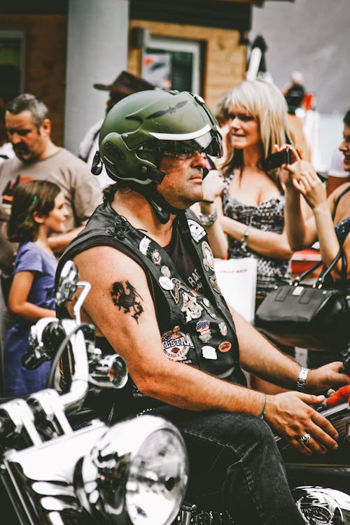 Photo of Man Riding Motorcycle