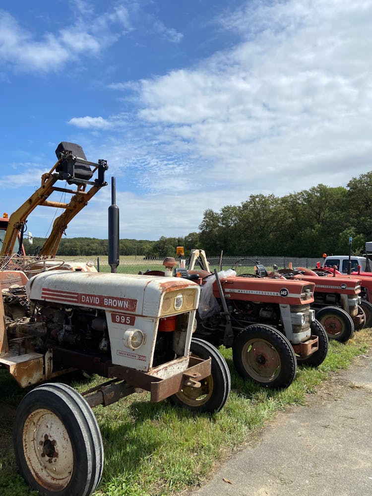 Tractors In Row In Green Countryside