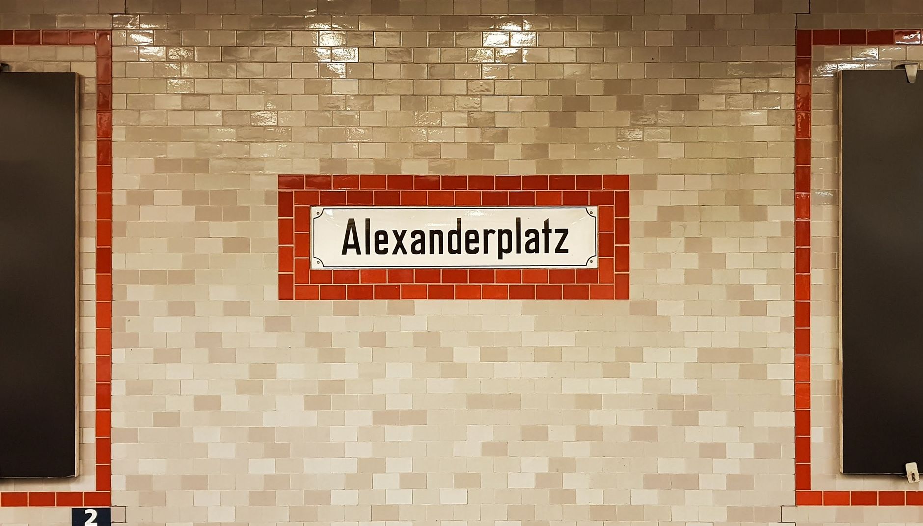 Alexanderplatz sign on tile wall at Berlin metro station, Germany.