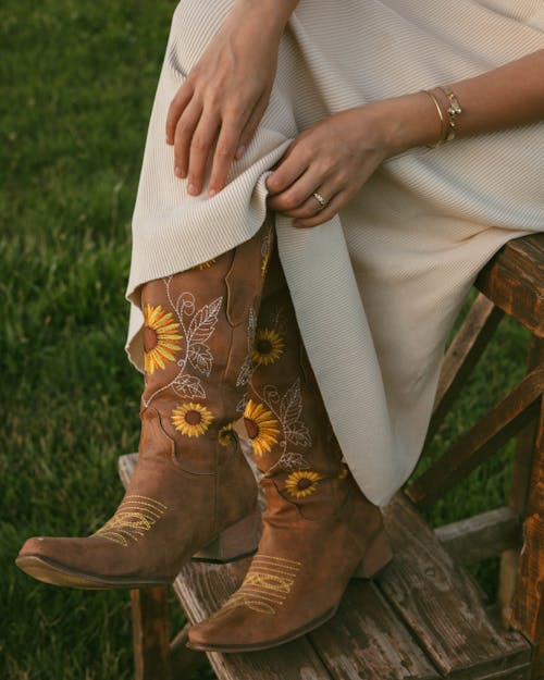Free Women Cowboy Boots in Sunflowers Stock Photo