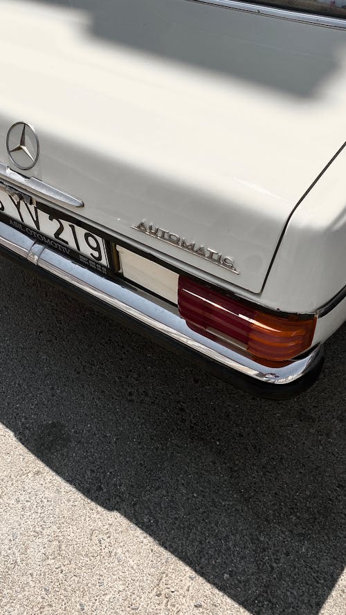 Retro White Mercedes on a Street 
