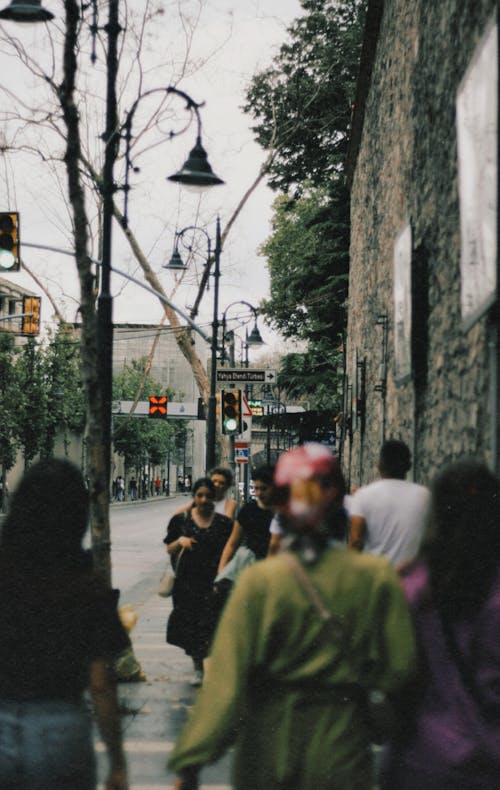 Pedestrians Walking along the Sidewalk