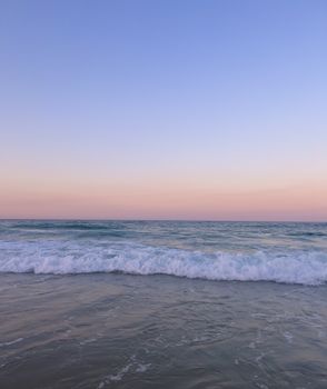 Beautiful dusk view of the tranquil ocean waves, shot on Gold Coast with a serene sky backdrop.
