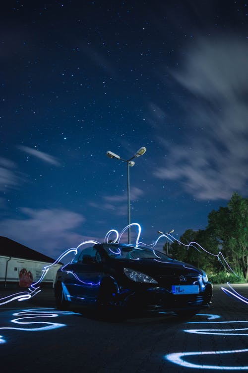 A Car on a Driveway at Night