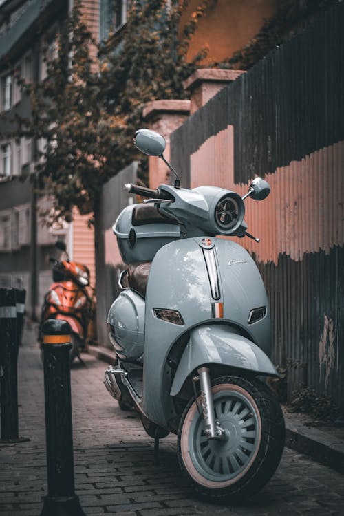 Vespa Parked on Sidewalk