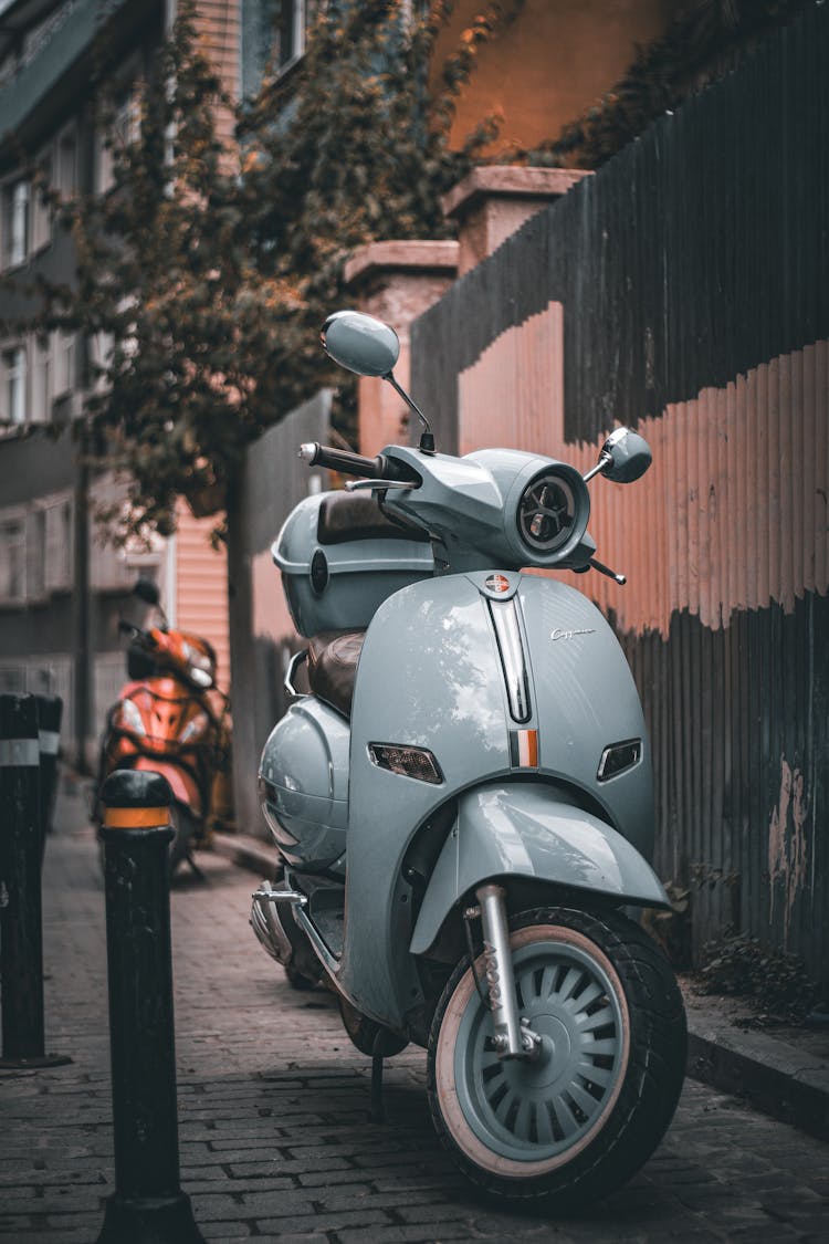 Vespa Parked On Sidewalk