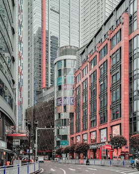 A dynamic city view featuring modern skyscrapers and urban architecture in a bustling downtown area.