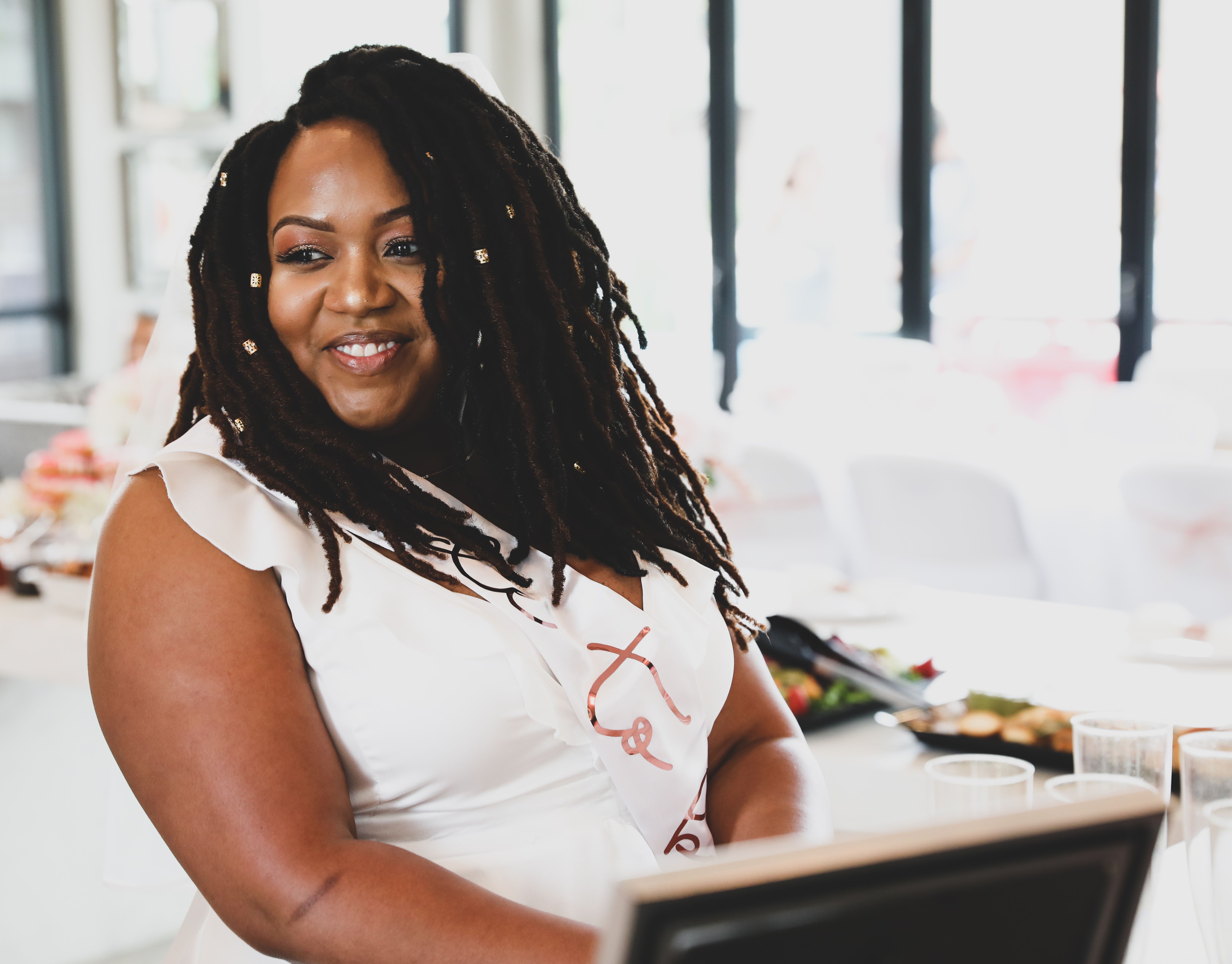 Smiling Black Woman with Dreadlocks in Restaurant · Free Stock Photo