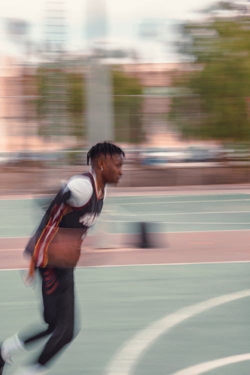 African Man Running on a Sport Field 