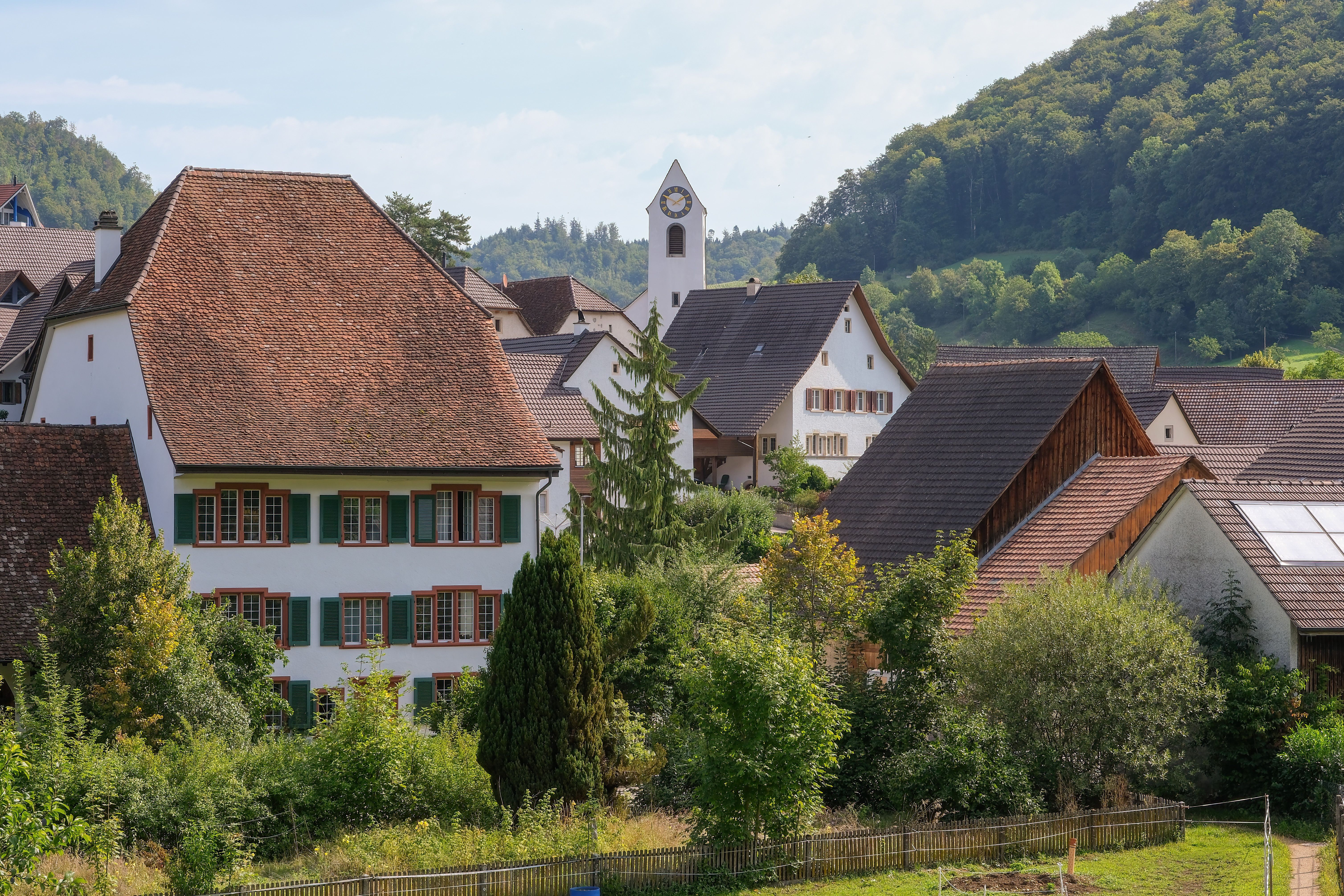 Swiss-inspired village with traditional architecture surrounded by pine trees — Crosswinds Tagaytay