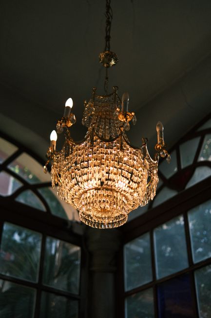 A striking crystal chandelier hangs gracefully, exuding luxury and elegance indoors.