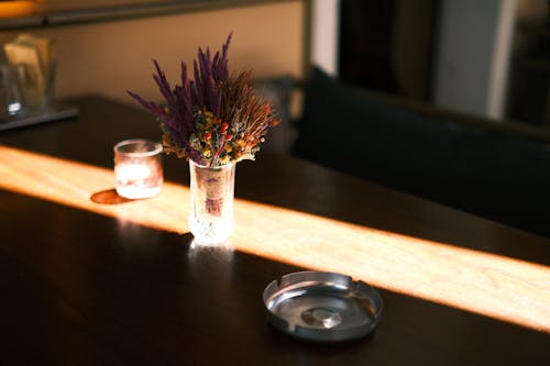 Dry Flowers in Glass on Table 