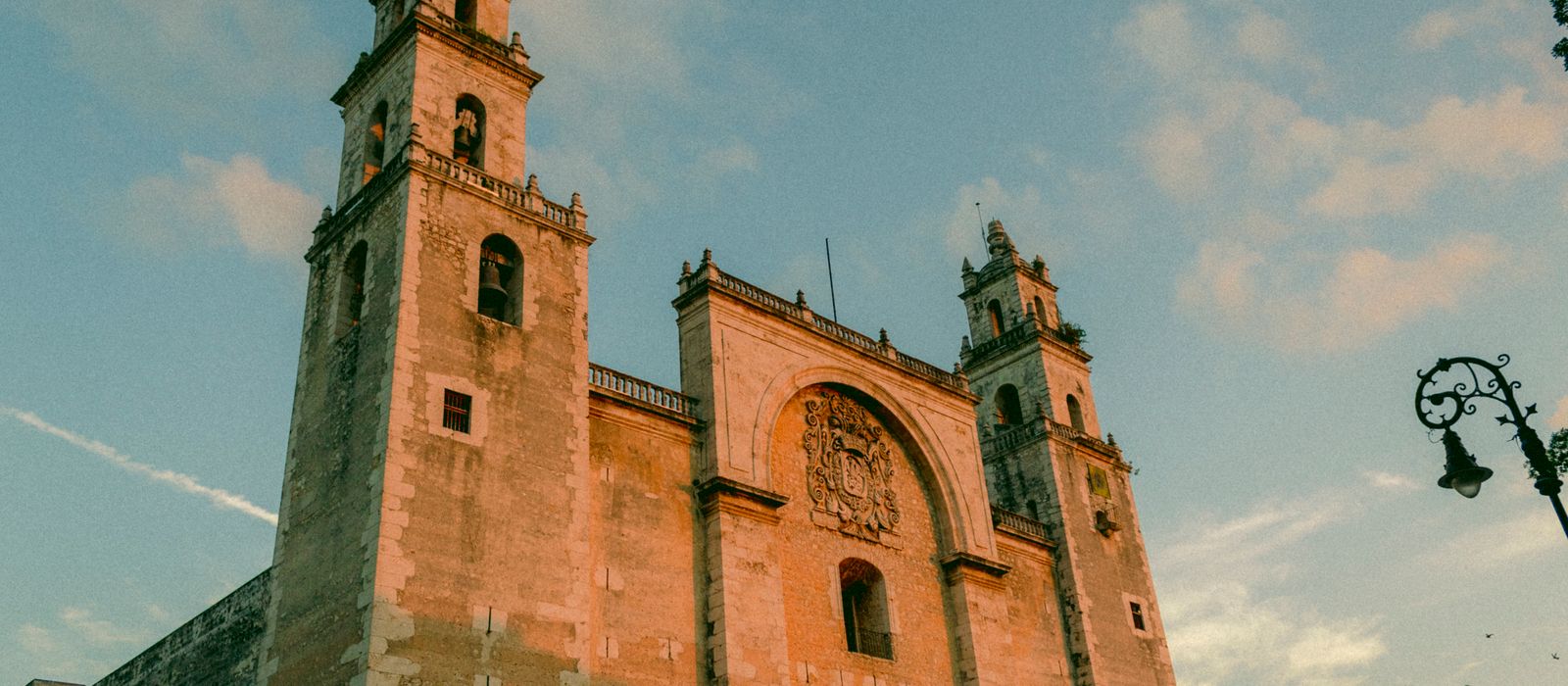 The grand facade of Mérida's iconic cathedral bathed in warm sunset light. — flights from Durango to Merida