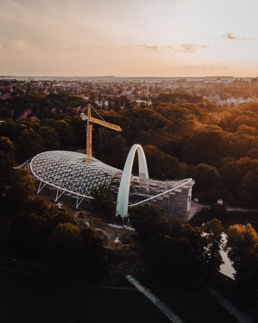 Drone shot of a modern architectural construction site in Szczecin during sunset.