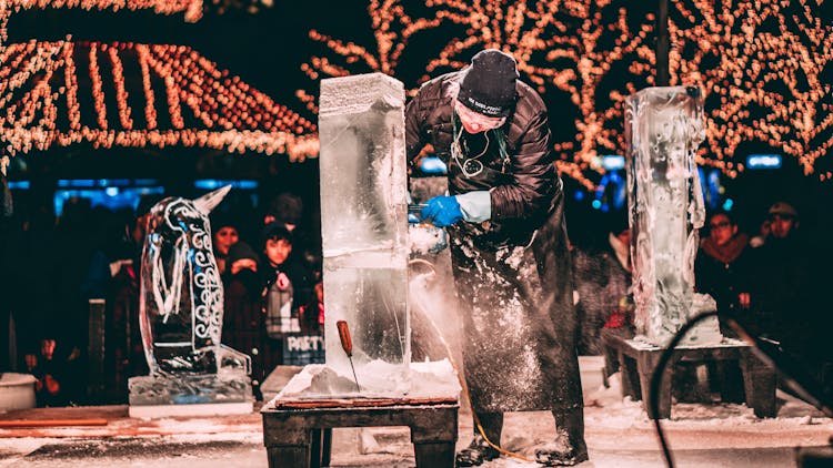 Person Carving Ice Sculptures