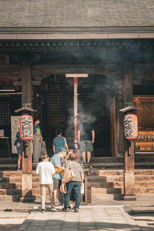 People in Front of Traditional Asian Temple 