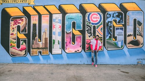 Man Posing By Street Art