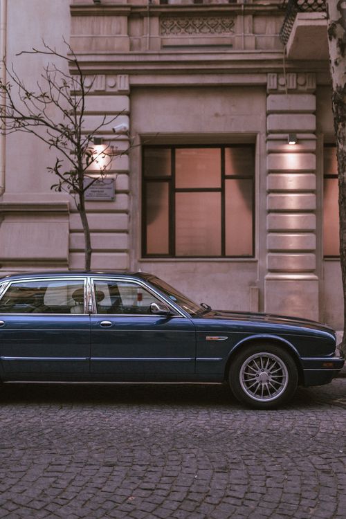 Free A vintage Jaguar car parked on a historic street in Baku, Azerbaijan. Stock Photo
