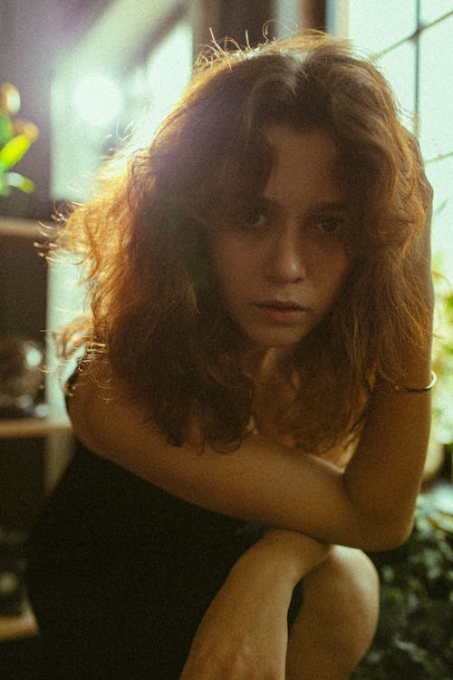 Woman with Brown Hair Sitting