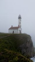 Lighthouse in fog — photo by Ekrem Metin on Pexels