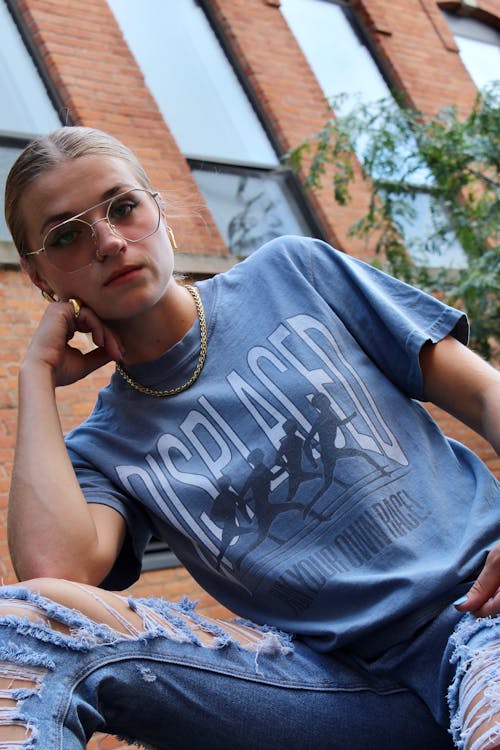 Woman Sitting and Posing in T-shirt