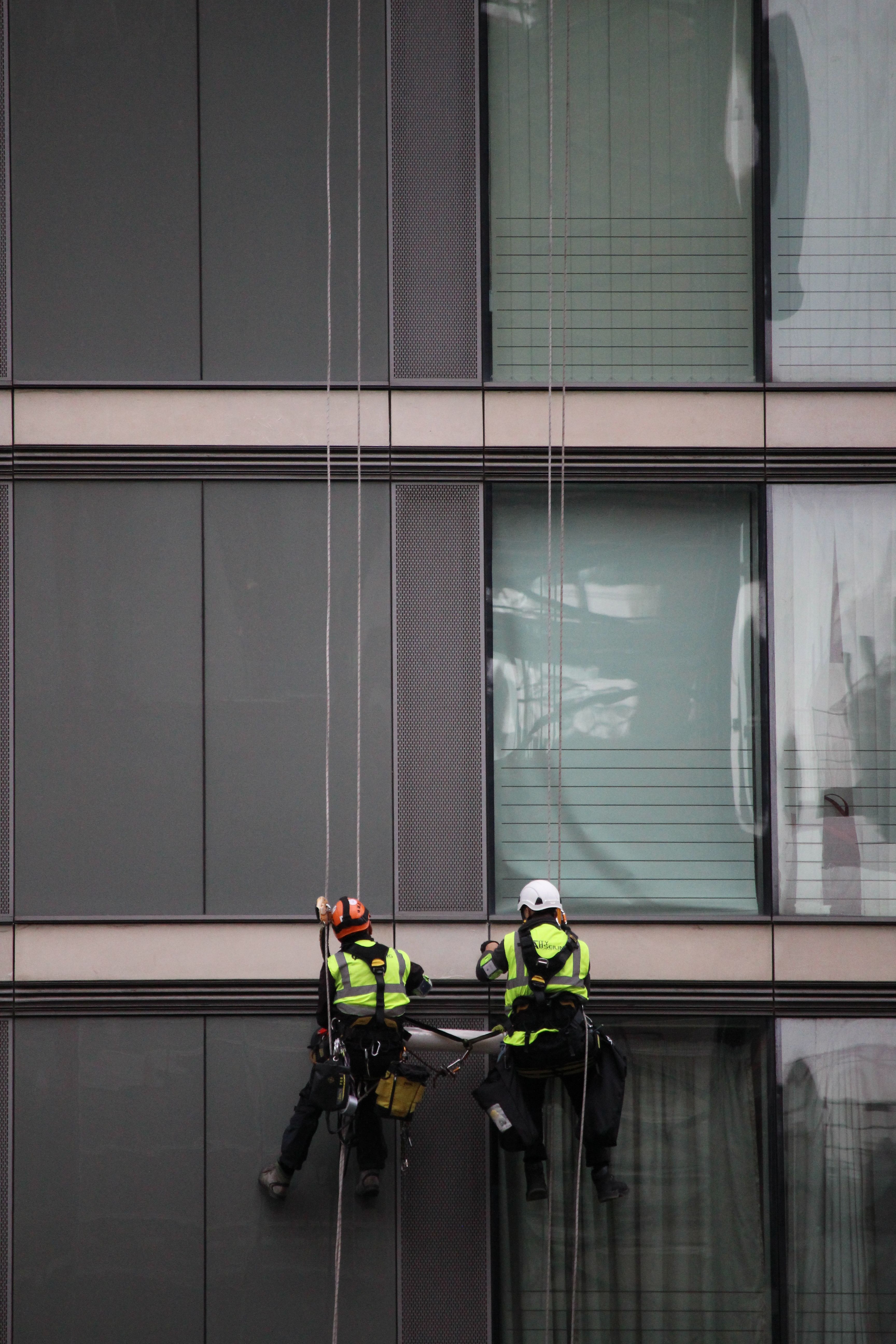 Cleaners Cleaning Windows on Altitude · Free Stock Photo