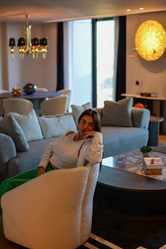 A fashionable woman lounging in a stylish Istanbul apartment living room setting.
