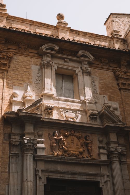 Free Close-up of a historic architectural facade in Valencia capturing classic details and textures. Stock Photo