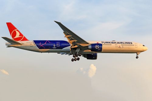 Free Turkish Airlines aircraft flying through a clear sky, showcasing its sleek design and vibrant livery. Stock Photo